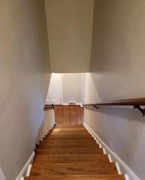 Bloomington house for rent - a staircase with wooden steps and white walls