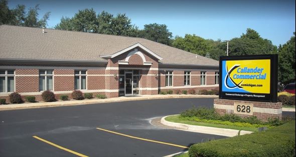 Portage apartment for rent - a building with a sign in front of it