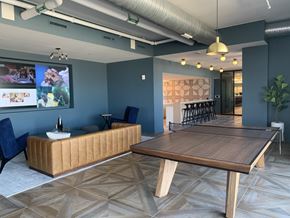Washington apartment for rent - A conference room with a long table and a sofa.