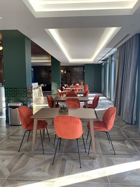 Washington apartment for rent - A dining room with a long table and chairs.
