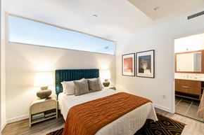 Washington apartment for rent - a bedroom with a large bed and a window