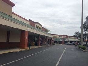 Tarpon Springs apartment for rent - A parking lot in front of a store with a sign that says "Holiday Inn".