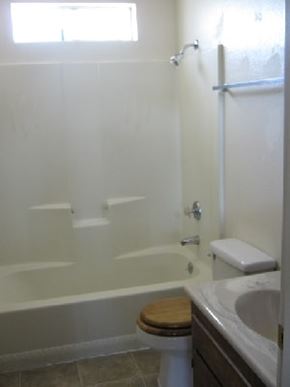 Grover Beach apartment for rent - A white bathroom with a toilet and sink.