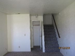 Grover Beach apartment for rent - A room with a staircase and a door.