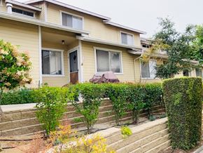 Grover Beach apartment for rent - A house with a well-maintained garden in front.