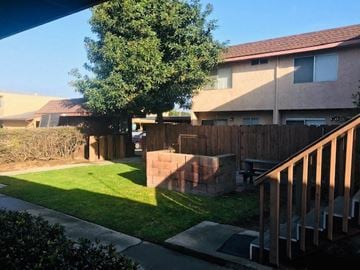 Arroyo Grande apartment for rent - A house with a brown roof and a green lawn.