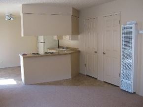 Arroyo Grande apartment for rent - A kitchen with a white fridge and cabinets.
