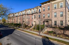 Covington apartment for rent - a row of brick apartment buildings on the side of a street