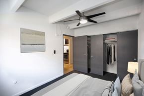 Denver apartment for rent - A modern living room with a grey sofa and a painting on the wall.