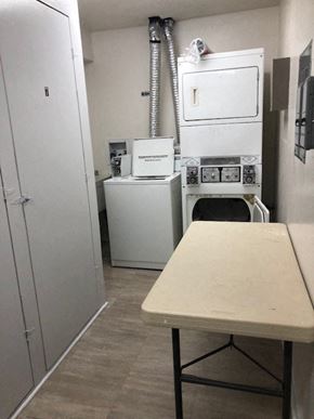 Island Lake apartment for rent - a small kitchen with a table and a stove
