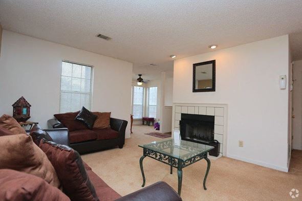 Jonesboro apartment for rent - a living room with couches and a fireplace