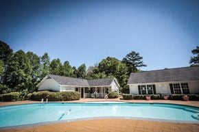 Jonesboro apartment for rent - a swimming pool in front of a house