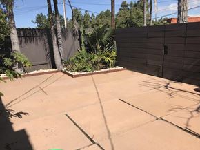 San Diego apartment for rent - a backyard with a concrete patio and a fence