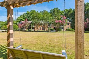 Durham apartment for rent - a swing in a yard with a house in the background
