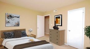 Charlotte apartment for rent - a bedroom with a bed and a dresser