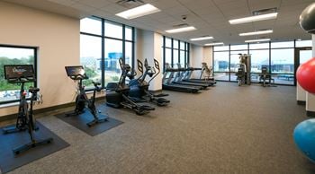 Rooftop fitness center featuring peloton bikes