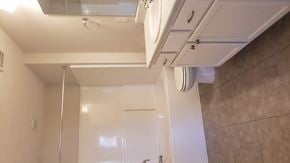 Harlem apartment for rent - a small bathroom with a shower and a sink
