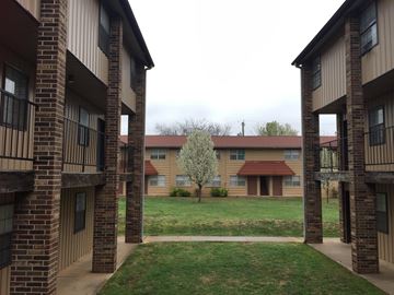 Stillwater apartment for rent - a view of a courtyard between two apartment buildings
