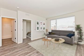 Chicago apartment for rent - a living room with a couch and a table