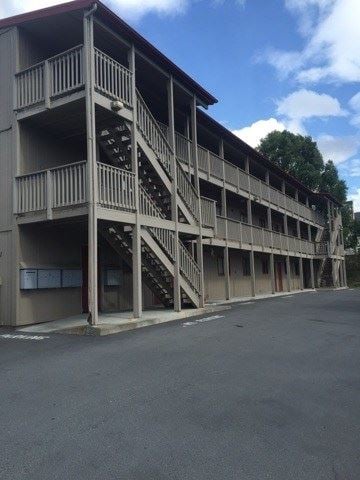 Anchorage apartment for rent - a building with stairs and a parking lot