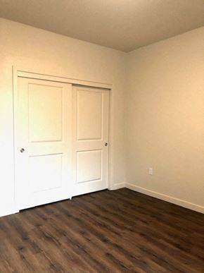 Gilroy apartment for rent - an empty room with white walls and a wooden floor