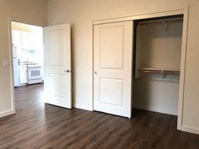 Gilroy apartment for rent - an empty living room with doors open to a kitchen