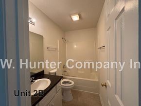 Wilson apartment for rent - A bathroom with a sink, toilet and bathtub.