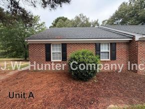 Wilson apartment for rent - A brick house with a sign that says J.W. Hunter Company Inc.