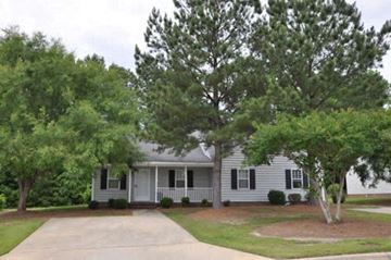 Wilson apartment for rent - a white house with trees in front of it