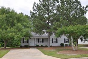 Wilson apartment for rent - a white house with trees in front of it