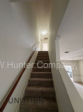Wilson apartment for rent - A staircase in a building with the text "V.Hunter Company" and "UNIT 10B" on the wall.