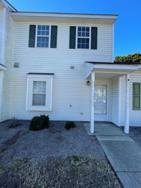 Wilson apartment for rent - A white house with a grey front yard.