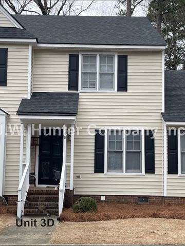 Wilson apartment for rent - A house with a white door and black shutters is for sale.
