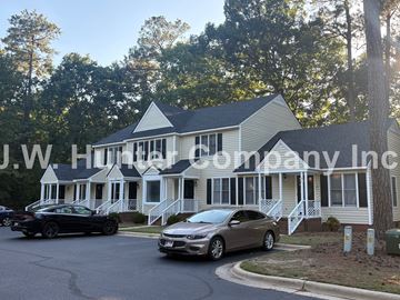 Wilson apartment for rent - A car dealership named J.W. Hunter Company Inc. is shown with two cars parked in front of a house.