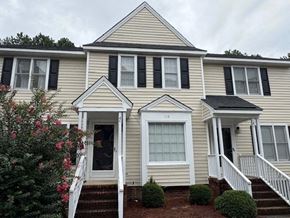 Wilson apartment for rent - A house with a front yard and a white door.
