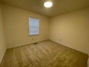 Wilson apartment for rent - A room with a window and carpeted floor.