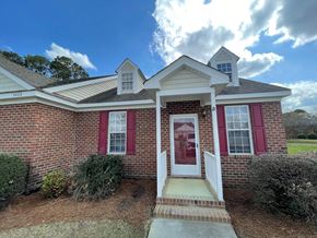 Wilson apartment for rent - A house with a red door and red shutters.
