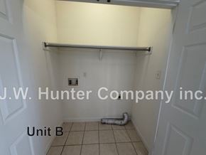 Wilson apartment for rent - A white door with a sign that says J.W. Hunter Company inc. Unit B.