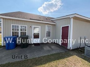 Wilson apartment for rent - A small building with the sign "J.W. Hunter Company Inc." on it.