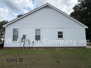 Wilson apartment for rent - A white building with the words J.W. Hunter Company Inc. on it.