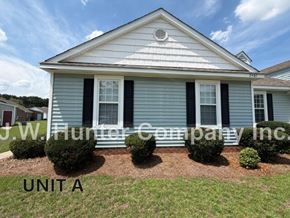 Wilson apartment for rent - A house with the text "J.W. Hunter Company Inc." on the front yard.