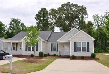 Rocky Mount apartment for rent - a white house with green shutters and a driveway