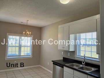 Wilson apartment for rent - A kitchen with a sink and a window.