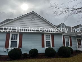 Wilson apartment for rent - A house with the sign "J.W. Hunter Company Inc." on it.