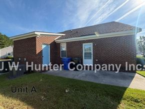 Wilson apartment for rent - A brick building with the sign J.W. Hunter Company Inc. Unit A.