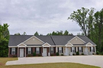 Rocky Mount apartment for rent - a brick house with a gray roof and white doors