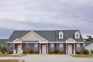 Rocky Mount apartment for rent - a large brick house with white doors and a gray roof
