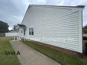 Wilson apartment for rent - A white building with the name J.W. Hunter Company Inc. on the side.