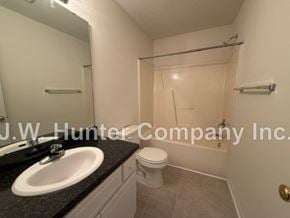 Wilson apartment for rent - A bathroom with a toilet, sink, and shower.