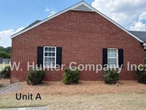 Wilson apartment for rent - A red brick building with the sign W.W. Hunter Company Inc. in front of it.